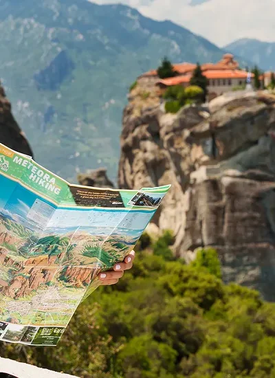 Beautiful tourist greece with meteora monasteries background